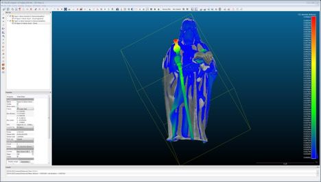 Screenshot. In this digital image, a sculpture of a man with long hair wearing long robes is superimposed on another almost identical sculpture. In each sculpture, the man holds something in each hand. A coloured depth map, using a spectrum from bright red to cobalt blue, overlays the original colour of the sculptures and indicates the range of differences between the two.
